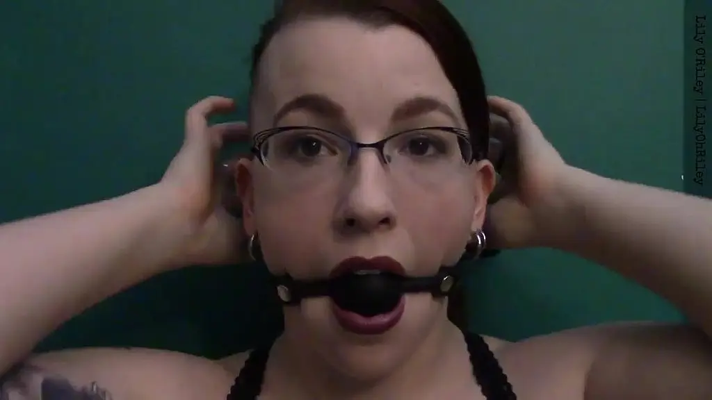 dark lipstick ballgag drooling with intense eye contact