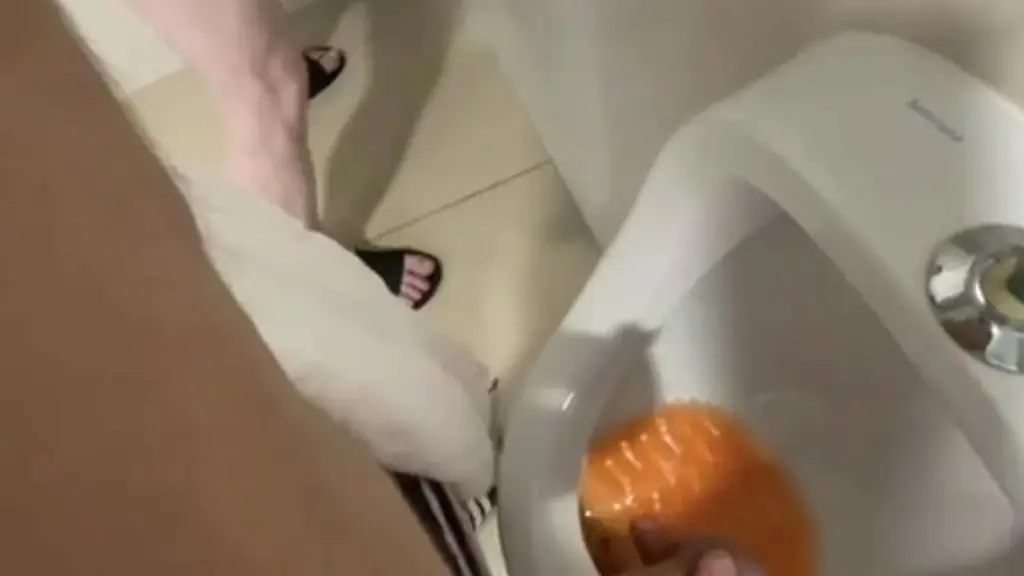 filming the guy peeing next to me at the urinal of the pool toilets
