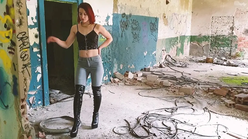 boots, jeans and crushing tease in an abandoned building