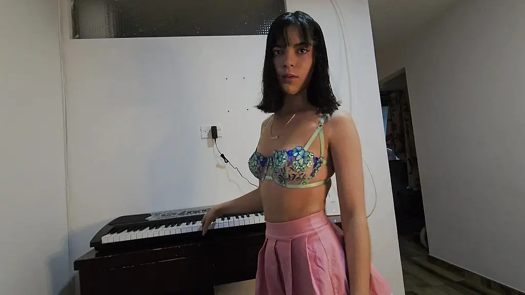 the beautiful laura! in sexy dress wants to learn to play the piano