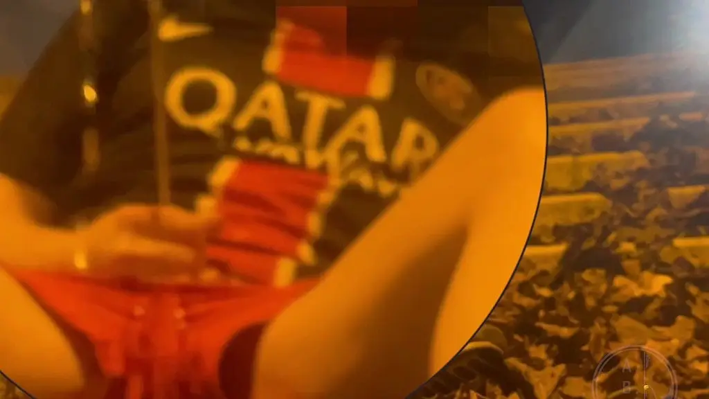 amateur boy in football gear and sneakers caught wetting himself in the street