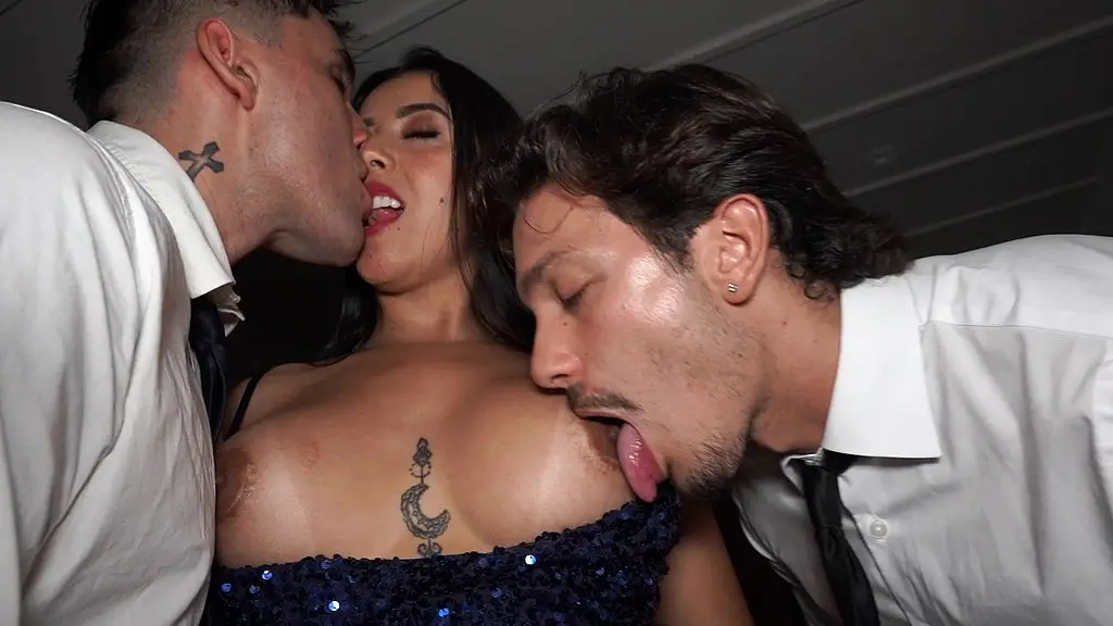brunette with a big ass and tits is interviewed by a couple of sexy guys with huge coc