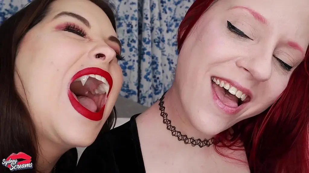 i got turned into a vampire now its your turn - lesbian vampire sydney screams bites her girlfriend violet october to turn her into a vampire too - vampire, biting, fangs, transformation