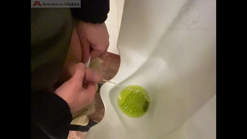 amateur redhead guy caught pissing in a public toilet s urinal - he then quickly plays with his cock before leaving