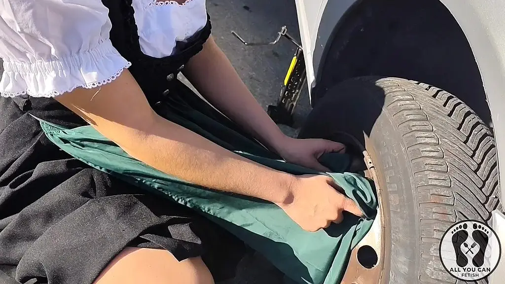 dirndl slut gets dirty and oily changing tires
