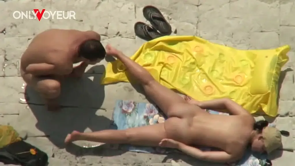 risky voyeur footage of girl gets licked in waves then pounded under the sun