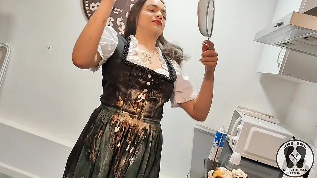 ana spears in dirndl cooking a special cake