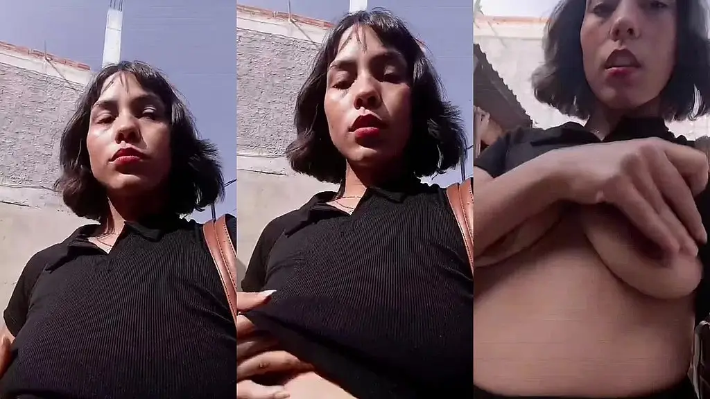 mostrando os meus peitos no meio da rua