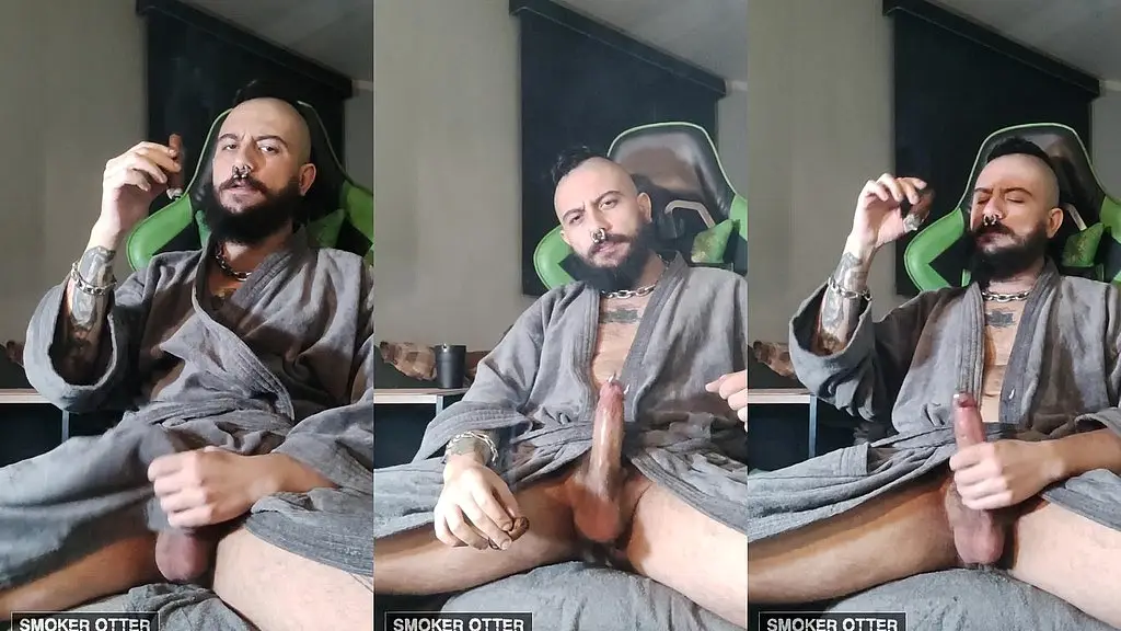 tattoed daddy smoking a cigar in his smoky robes