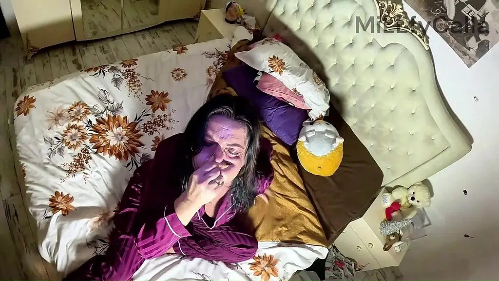 air holding in satin pajamas. puffy cheeks, red face & intense struggle