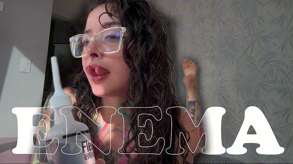 a girl with a split tongue gives herself an enema on camera.
