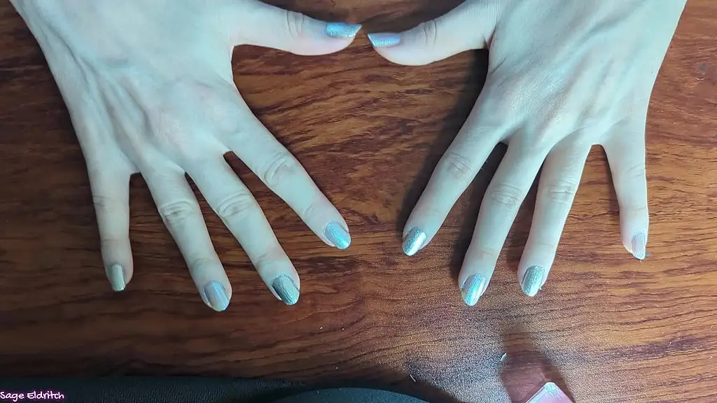 sage eldritch painting her fingernails opal and silver [sfw]