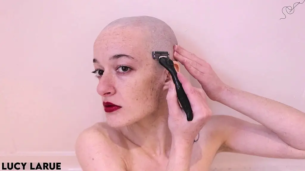 red lips and a razor candid bald girl head shave